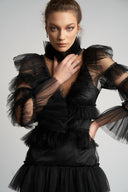 Black mini dress with tulle ruffles and deep neckline