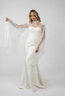 Mermaid dress with accessorized embroidery and flared sleeves