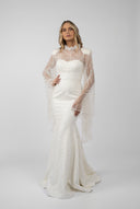 Mermaid dress with accessorized embroidery and flared sleeves