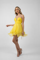 Short yellow strapless dress with gathered bodice