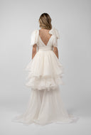 Dress with long detachable skirt and dramatic ruffles